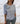 Polera 3 rosetones celeste