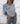 Polera 3 rosetones celeste