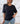 Polera 3 rosetones negro